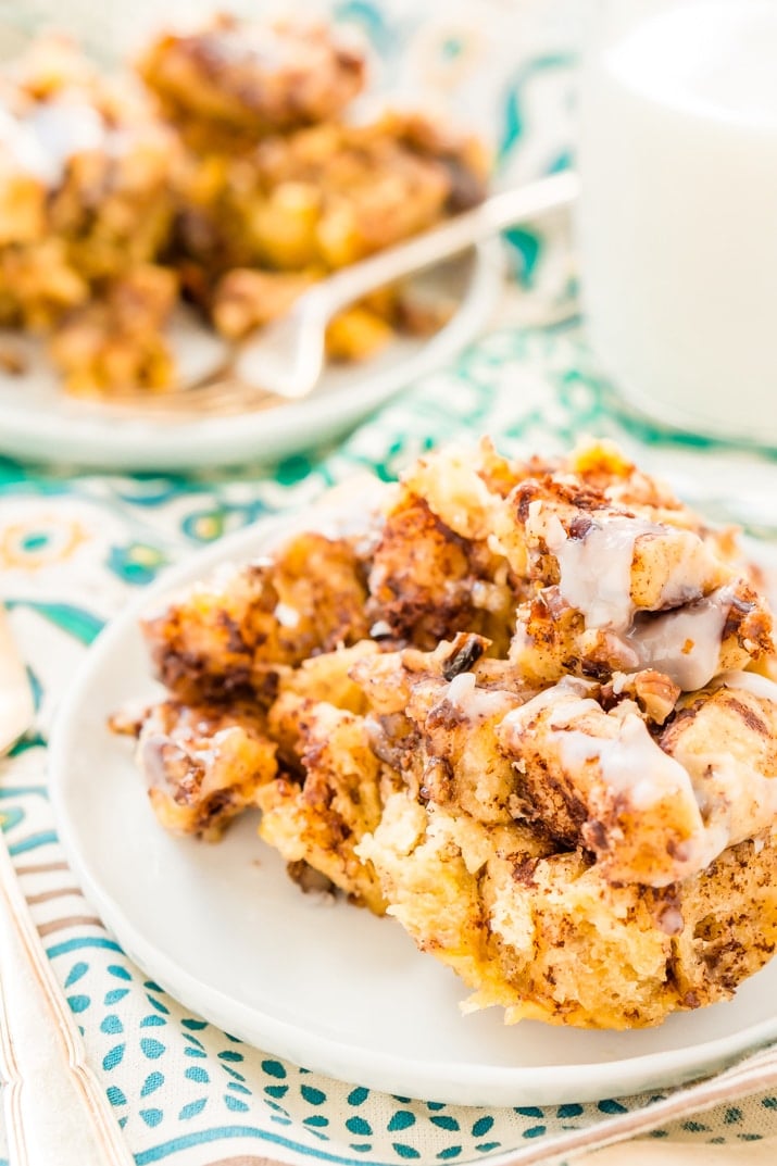 This Slow Cooker Cinnamon Roll Casserole is the perfect lazy breakfast for weekends and holidays! An easy and delicious sweet breakfast treat that's loaded with cinnamon, maple, pecans, and more!